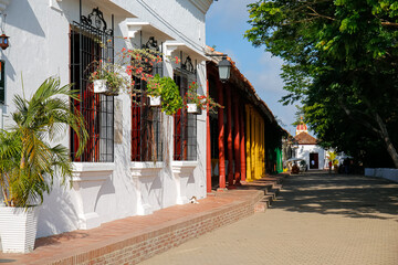 Typical historic houses in warm afternoon light, trees and river,  Santa Cruz de Mompox, Colombia, World Heritage"