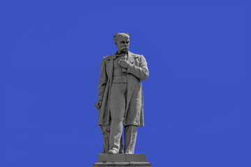 Dnipro, Ukraine - July 21, 2020:  Taras Shevchenko Monument on Monastyrsky Island in Dnipro, close up isolated on a blue sky background. Cast iron sculpture was installed in 1959. Author - Ivan Znoba
