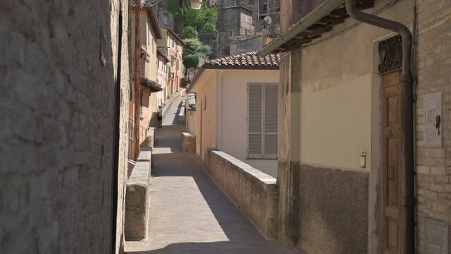 Perugia, Umbria, Italy. August 2020. Beautiful view of the Appian Way. Coronavirus and social distancing mean that there is practically no one in this narrow alley.