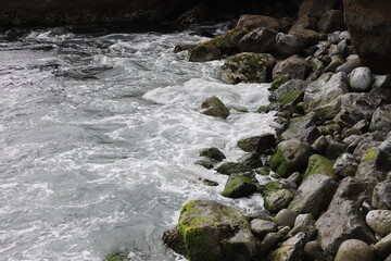 Waves from the Sea Crashing over Rocks on the Coast