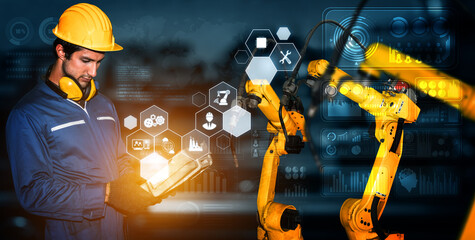 Smart industry robot arms for digital factory production technology showing automation manufacturing process of the Industry 4.0 or 4th industrial revolution and IOT software to control operation .