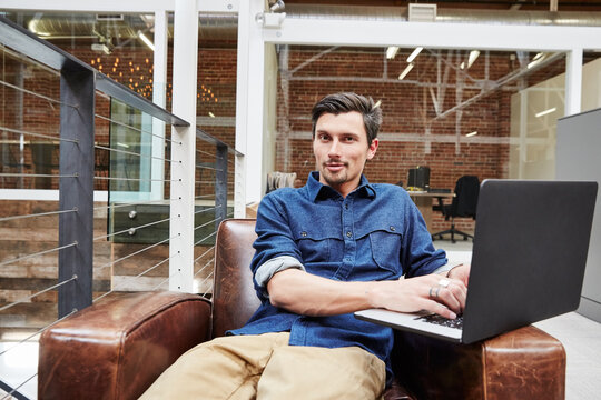 Portrait of millennial businessman at the office