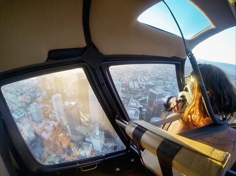 Photographer photographing Los Angeles from the air
