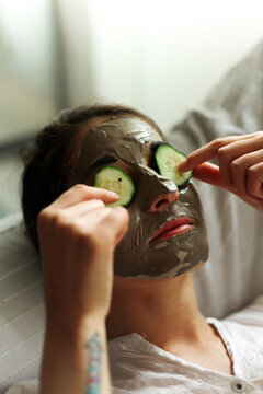 Woman having a cosmeting treatment in her home