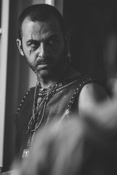 Scarface, the man in the leather vest with tattoo, attitude