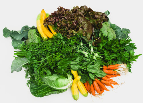 a variety of vegetables arranged on white