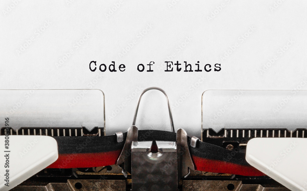 Poster text code of ethics typed on typewriter