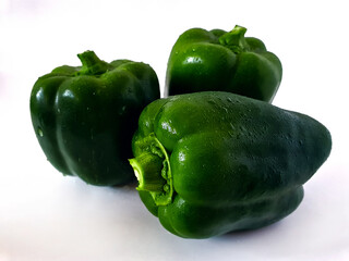 Fresh organic tomatoes and peppers on white background