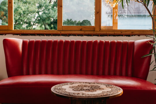 Empty red sofa in a porch