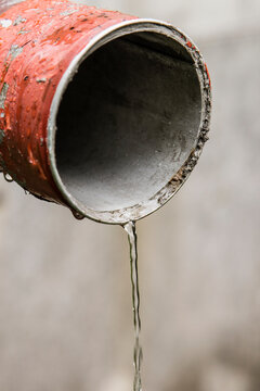 Water flowing from a pipe after rain