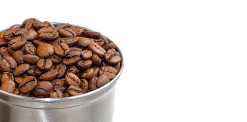 A lot of coffee beans in a metal coffee grinder on a white background