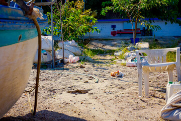 Cat lies and enjoys on the sandy beach