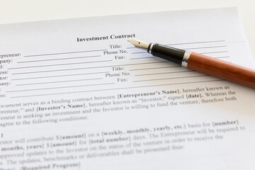 Closeup of contract and pen.