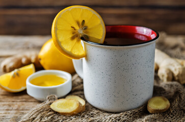 Cup of black tea with honey, lemon and ginger