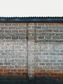 Muddy Exposed Brick Wall