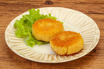 Vegan cuisine - Potato cutlet in the plate