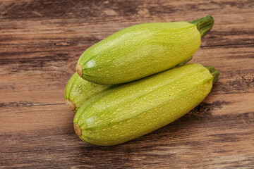 Young tasty zucchini over board