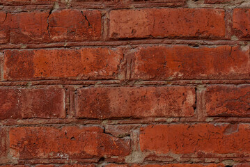 Old red brick wall texture background close up