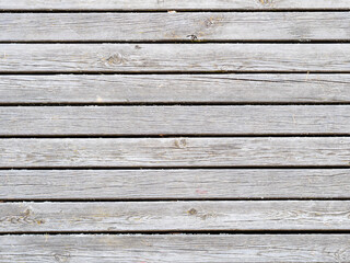 shabby gray wooden planks of outdoor pavement of pier