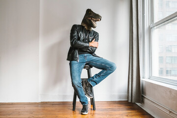 Man with a T-Rex mask