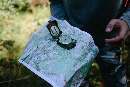 Man orienteering with the compass and map