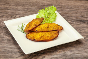 Baked potato with herbs and spices
