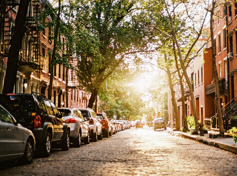 A sun bathed cobble stone street in New York