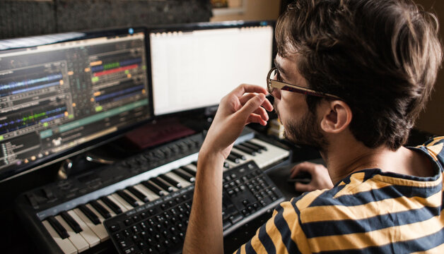 DJ/audio producer working in his music studio