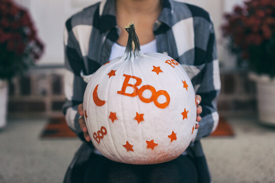 Painted: Girl Holding Fun White Painted Pumpkin
