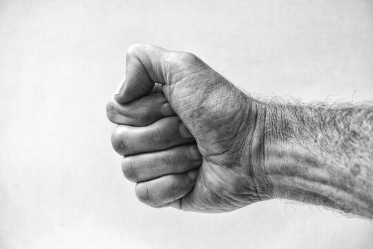 Grainy black and white of a middle aged male hand