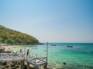 Naklejka premium Chonburi/Thailand - 20 apr 2019:Tourist with Tropical Ocean and Boat on Koh lan Island in vacation time. Koh lan island is the Famous island near Pattaya city the Travel Destination in Thailand.