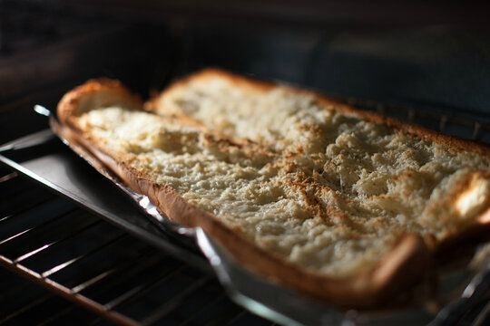Garlic bread browning in the oven