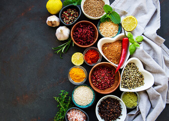 Various spices in a bowls on a black