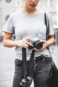 Monochrome Female Photographer Holding an Old Analog Camera