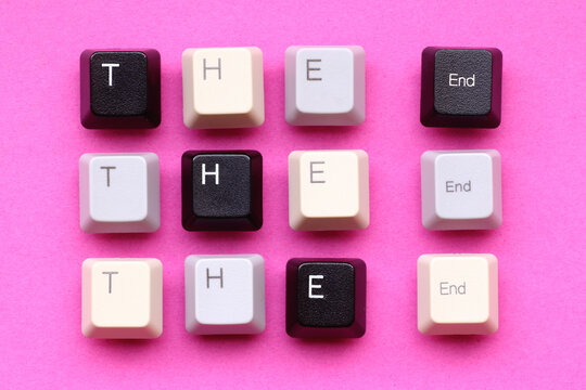 'The end' written with computer keyboard keys on a paper background
