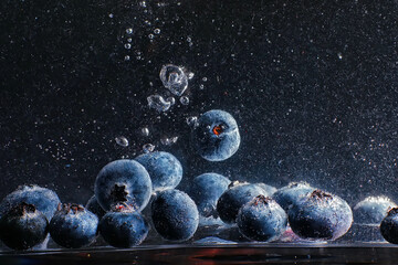 Water drops on ripe sweet blueberry. Fresh blueberries background with copy space for your text. Vegan and vegetarian concept.