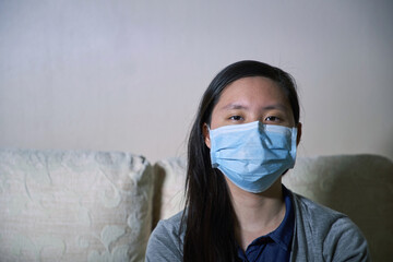 Close-Up Portrait Of Young Woman Wearing Mask