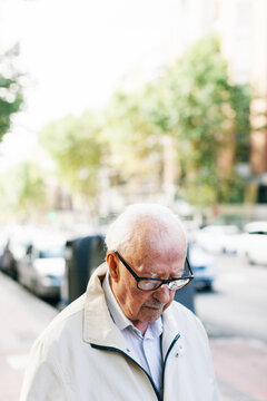 Elderly man walking on the street.