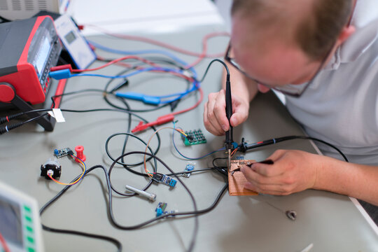 Young technican working in lab