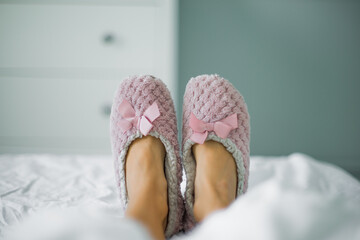lying in bed with slippers