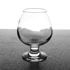 Brandy glass on table on white background
