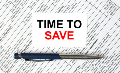 Text Time To Save written on a business card lying on financial tables with a blue metal pen