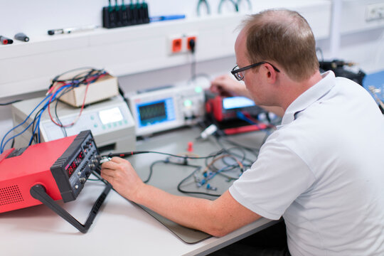 Young technican working in lab