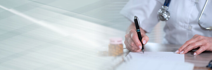Female doctor writing prescription; panoramic banner
