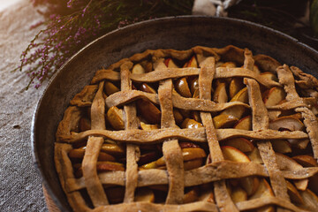 Preparation, Thanksgiving Day celebration. Baked apple pie on a baking sheet. Close-up. Making a traditional apple pie.