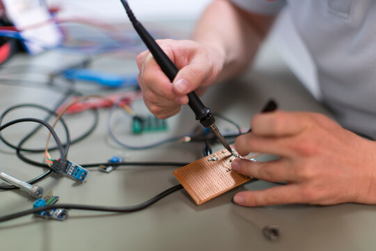 Young technican working in lab