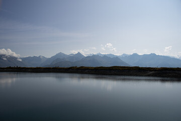 Fototapeta premium artificial lake with the Austrian Alps in the background