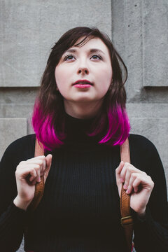 Young woman looking up