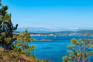 Fototapeta na wymiar Aerial view of the Galician coast at the opening of the Ria de Pontevedra, were the Atlantic ocean meets the land.