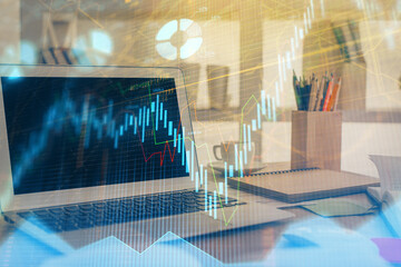 Forex market graph hologram and personal computer on background. Multi exposure. Concept of investment.